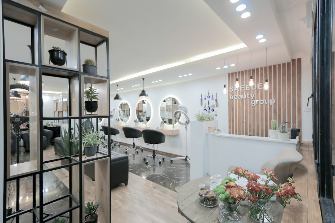 A welcoming salon interior with furniture and a vase of flowers on a table